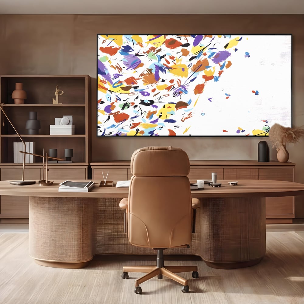 Tablou canvas cu pictura abstracta cu frunze colorate, in rama de aluminiu negru, pe perete intr-un birou